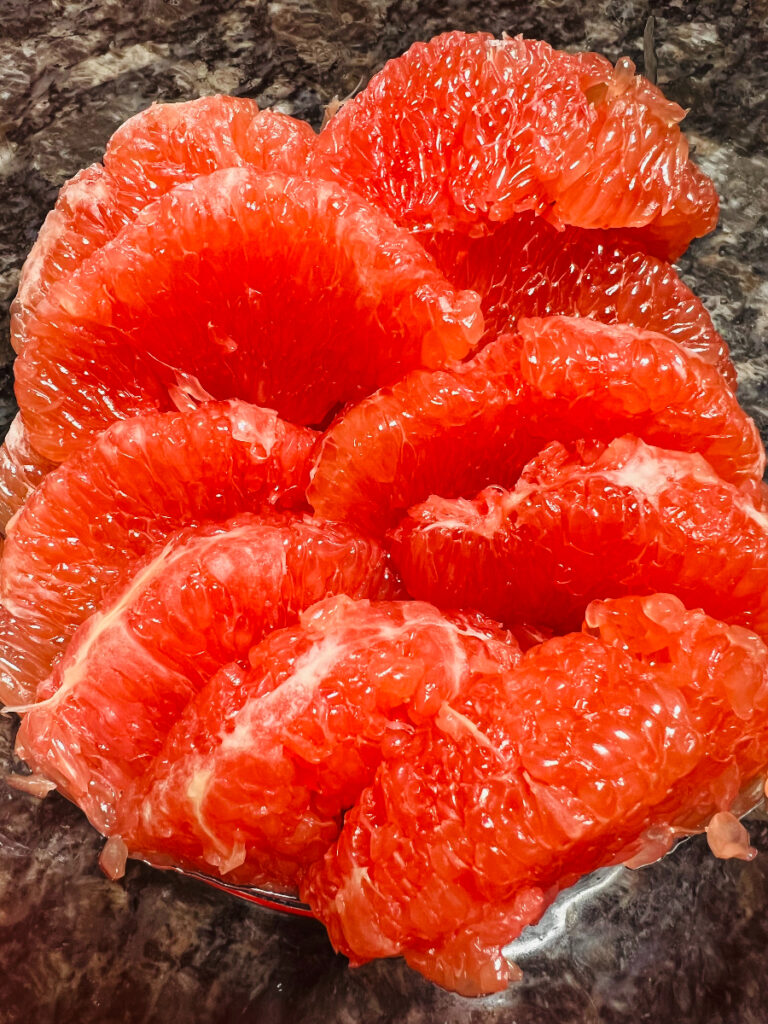 Peeled ruby red grapefruit segments
